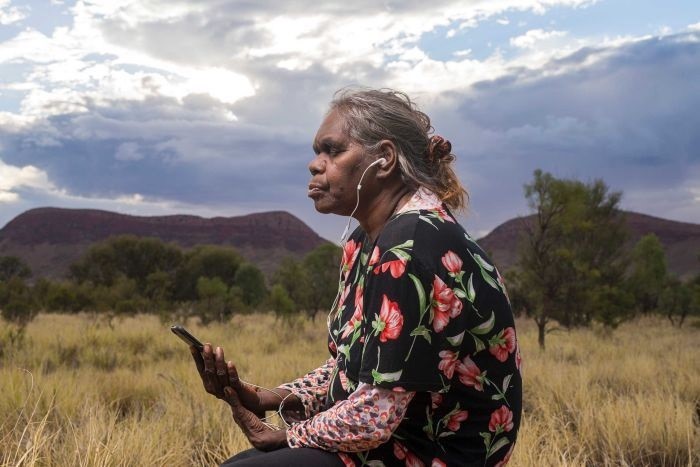 Rene Kulitja listening to meditations that she helped to create.